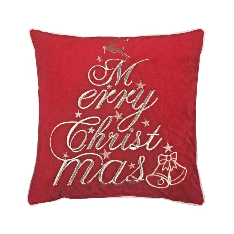 Red velvet throw pillow displayed on a bed, perfect for embracing the warmth and spirit of the Christmas season.